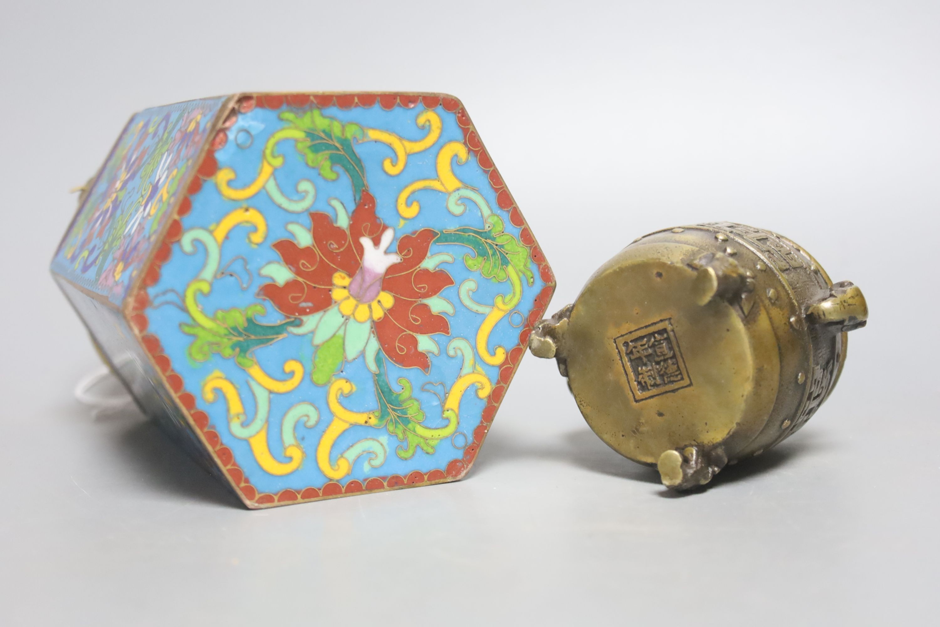 A Chinese small bronze tripod censer, a Chinese archaistic bronze tripod vessel, a bronze jar and cover and a cloisonné enamel wine warming pot